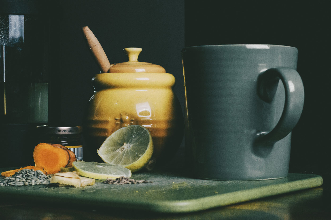 tea mug with honey, lemon, and turmeric