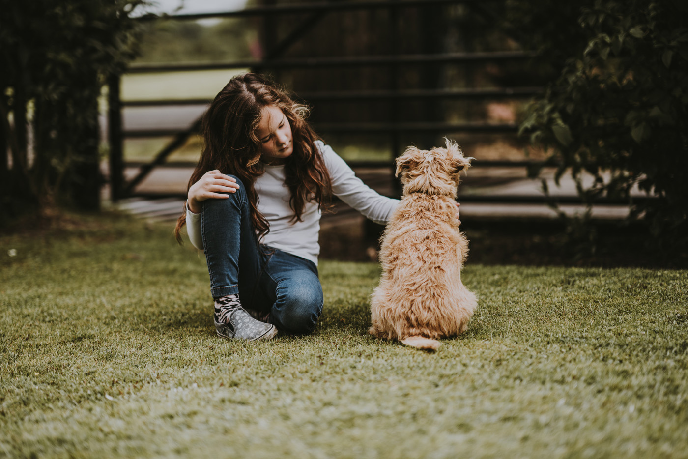 child with pet dog