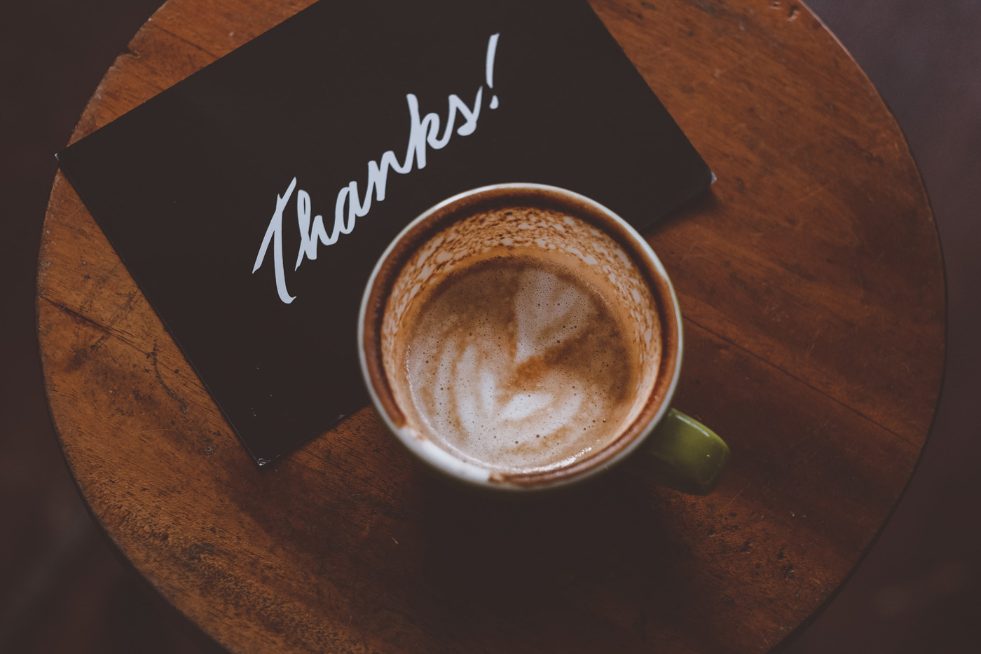 cup of coffee with heart and thank you card