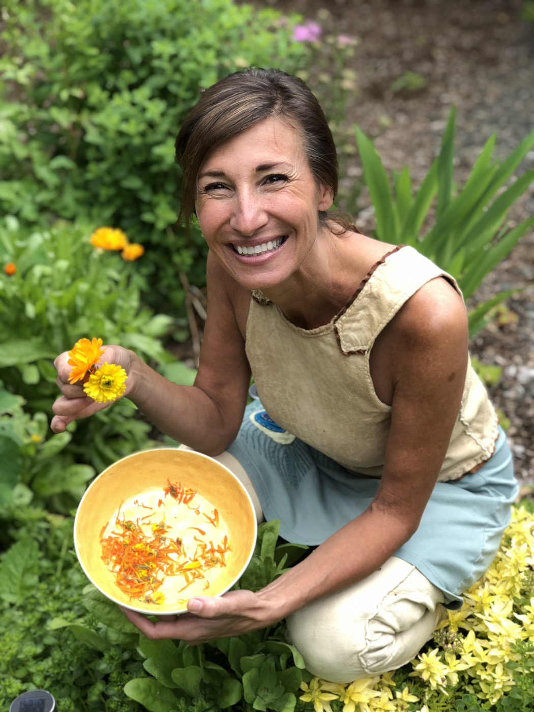 Nicole Apelian harvesting calendula flowers