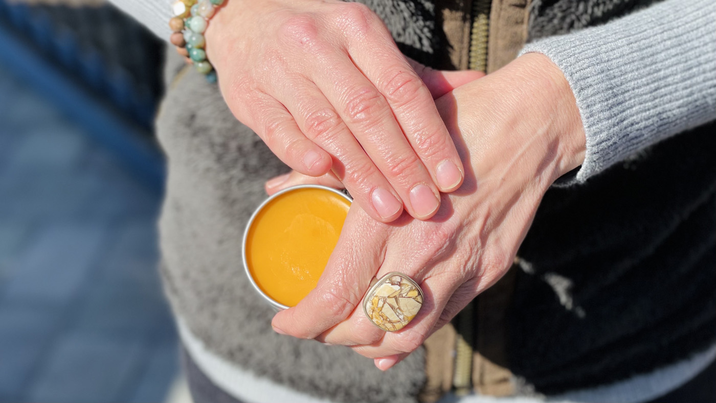 Nicole Apelian using salve on hands