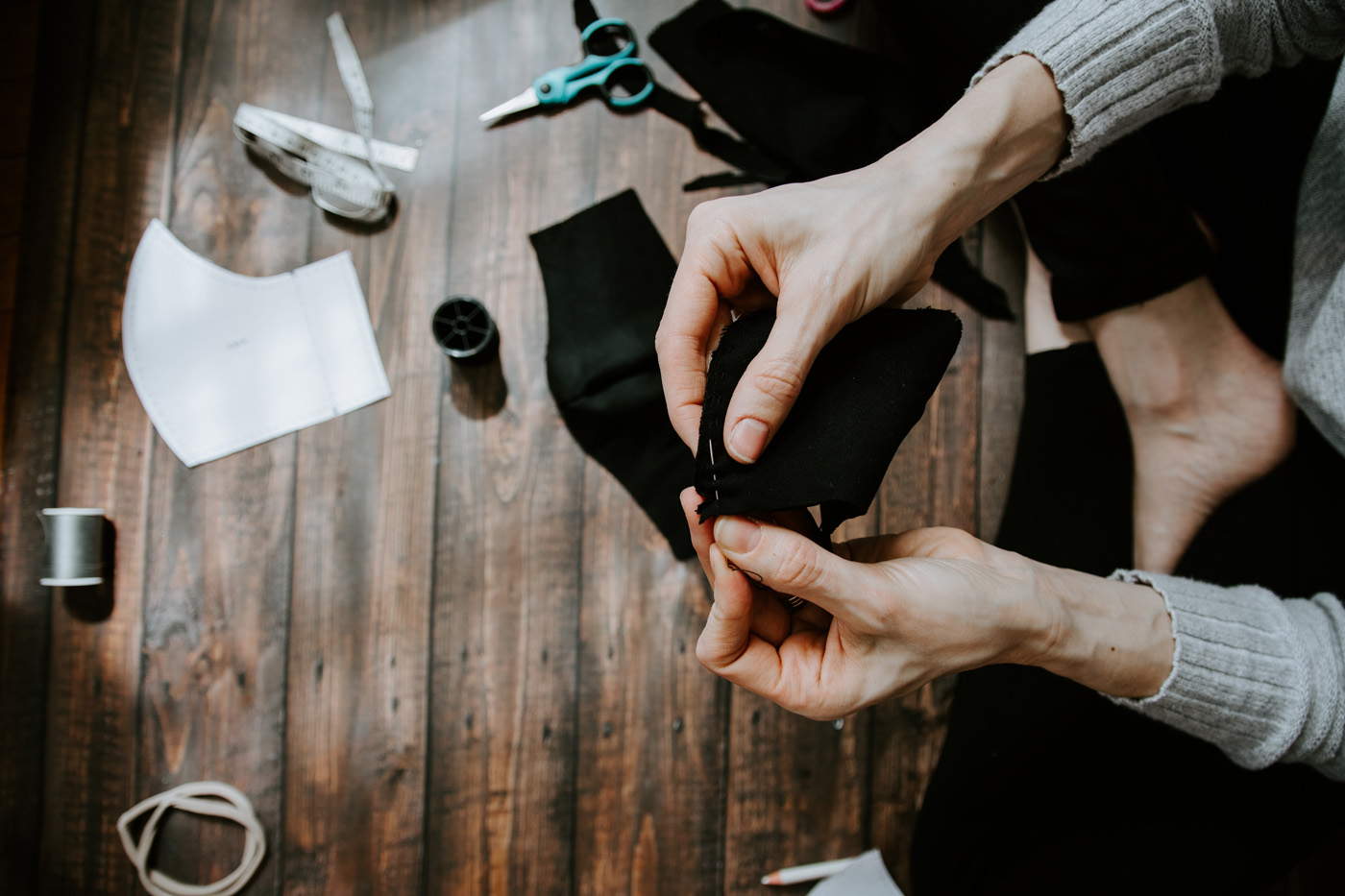 hand sewing black mask