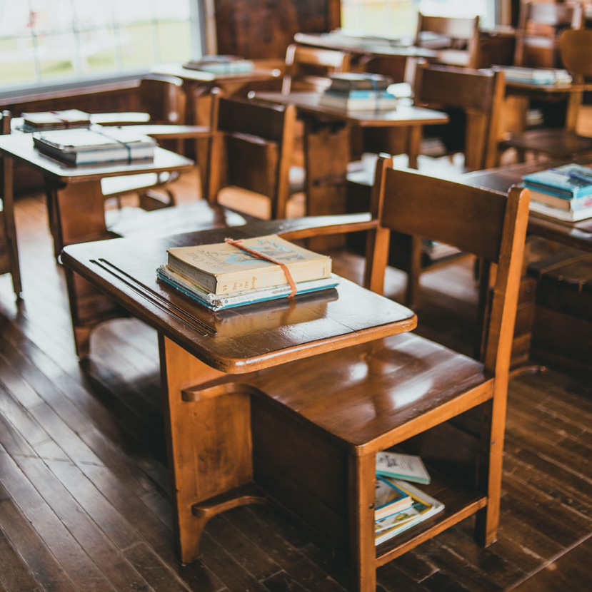 classroom with desks and books