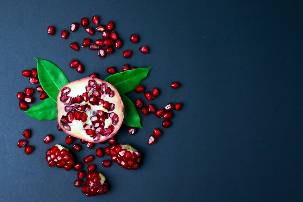 pomegranate seeds fruit and leaves