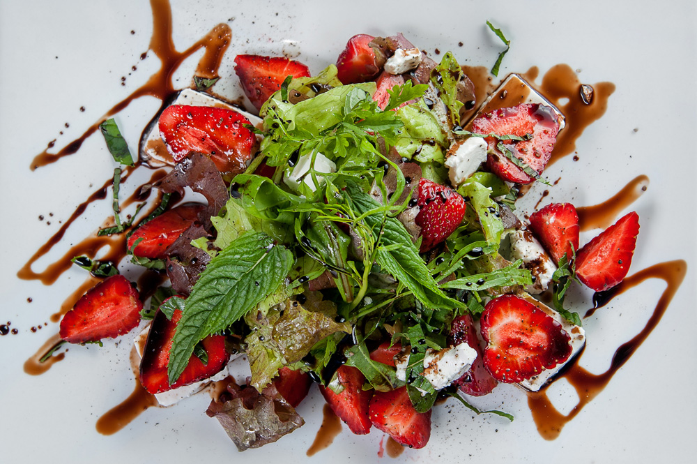 salad with strawberries, feta cheese and balsamic sauce, mint