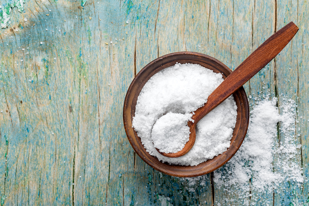 salt in bowl on weathered wood