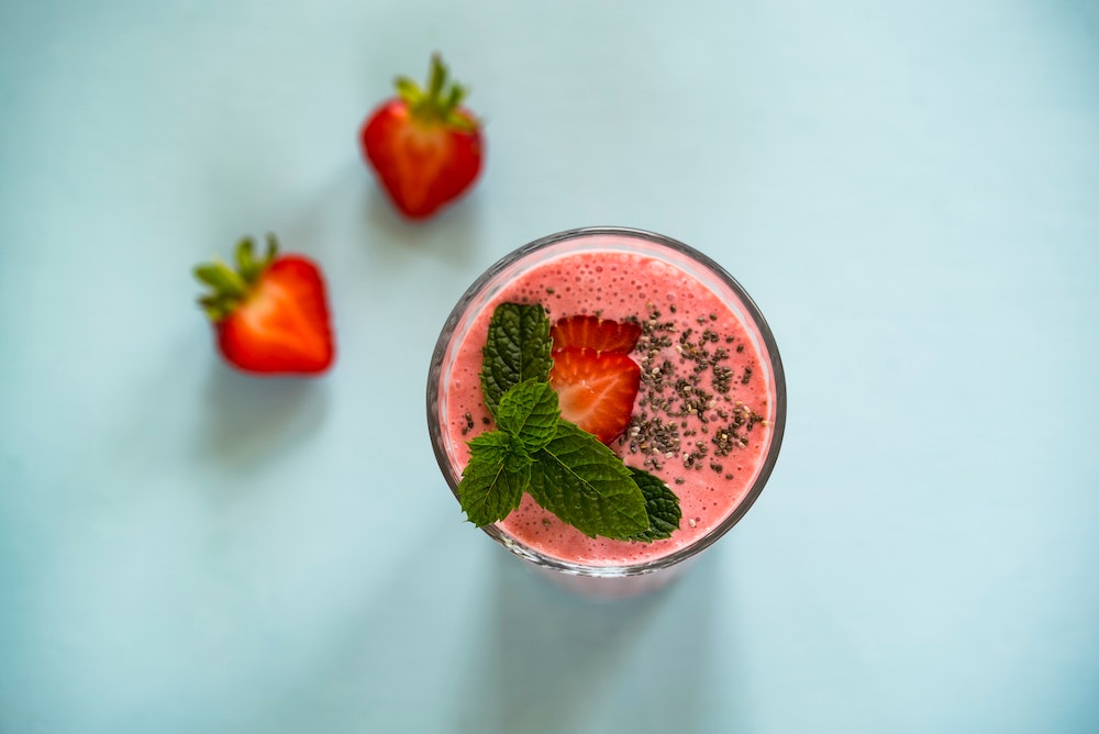 strawberry smoothie on a blue background