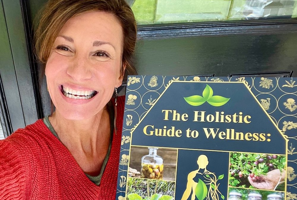 Nicole Apelian and her Holistic Guide book