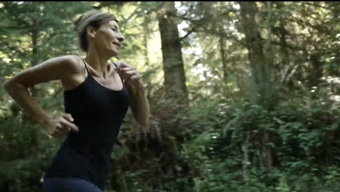 Nicole Apelian trail running in the woods