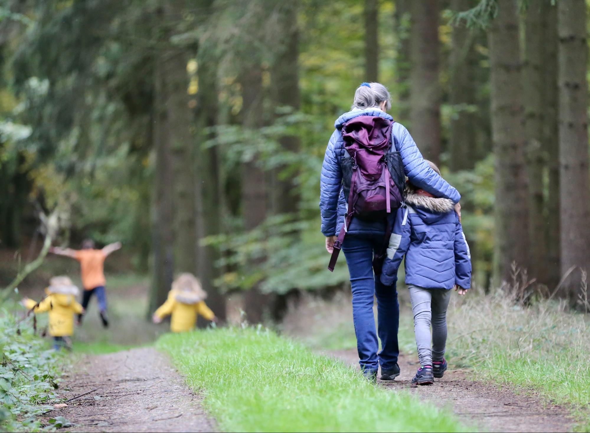 parent and child hiking together