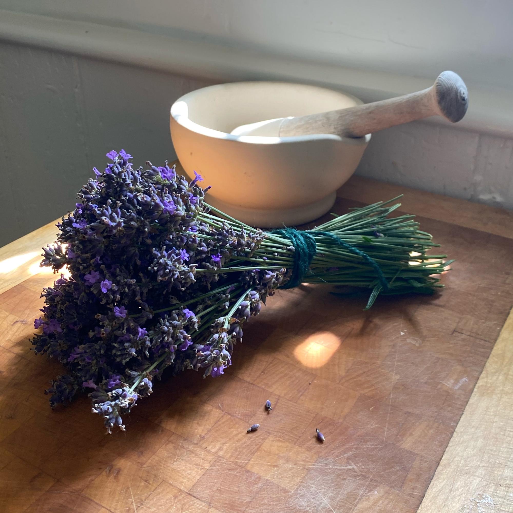bunch of lavender with mortar and pestle