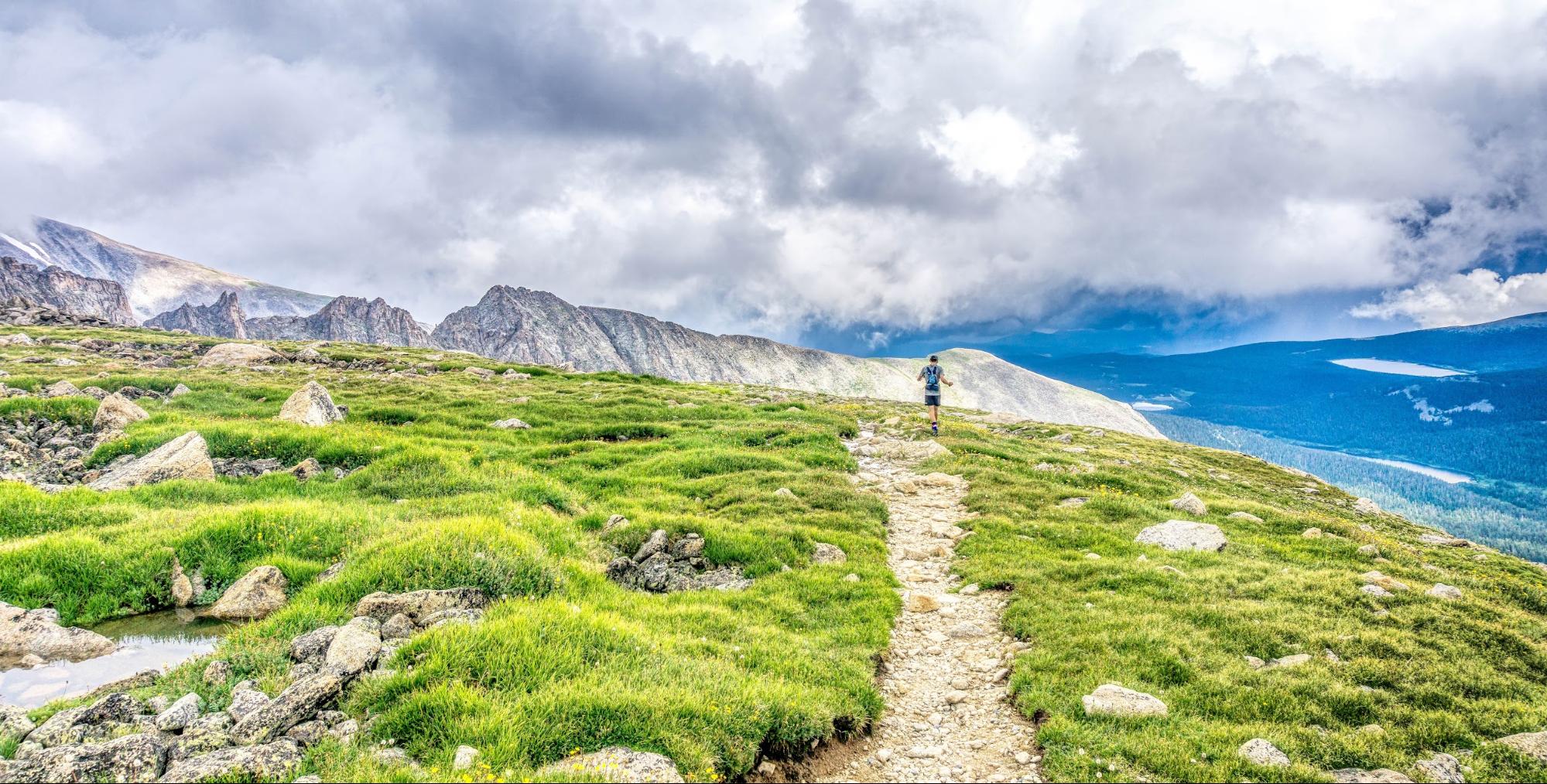 person running path on a mountain