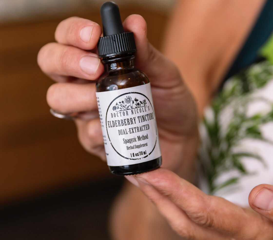 Nicole Apelian holding Nicoles Apothecary Elderberry Tincture