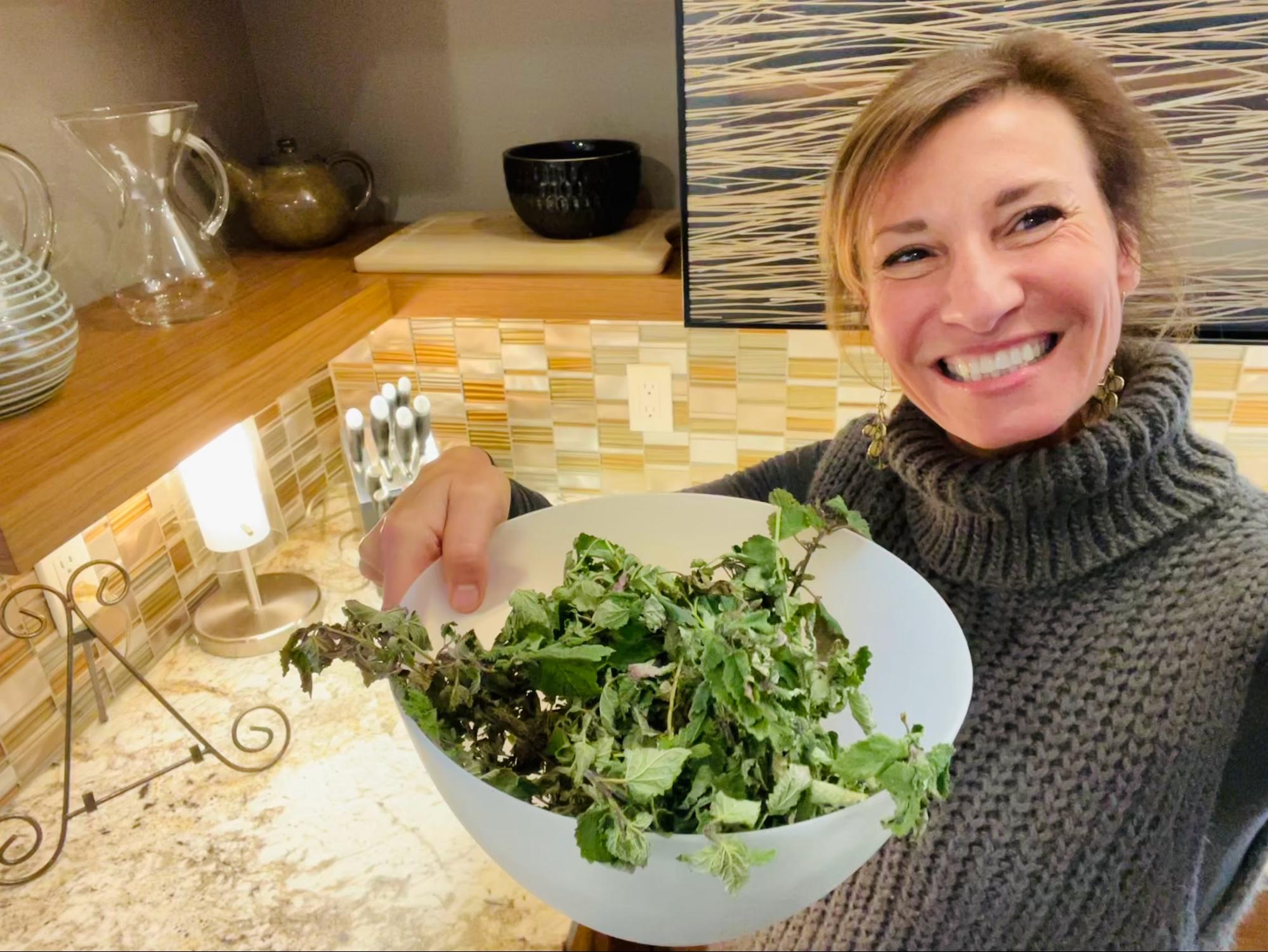 Nicole Apelian holding salad in a bowl