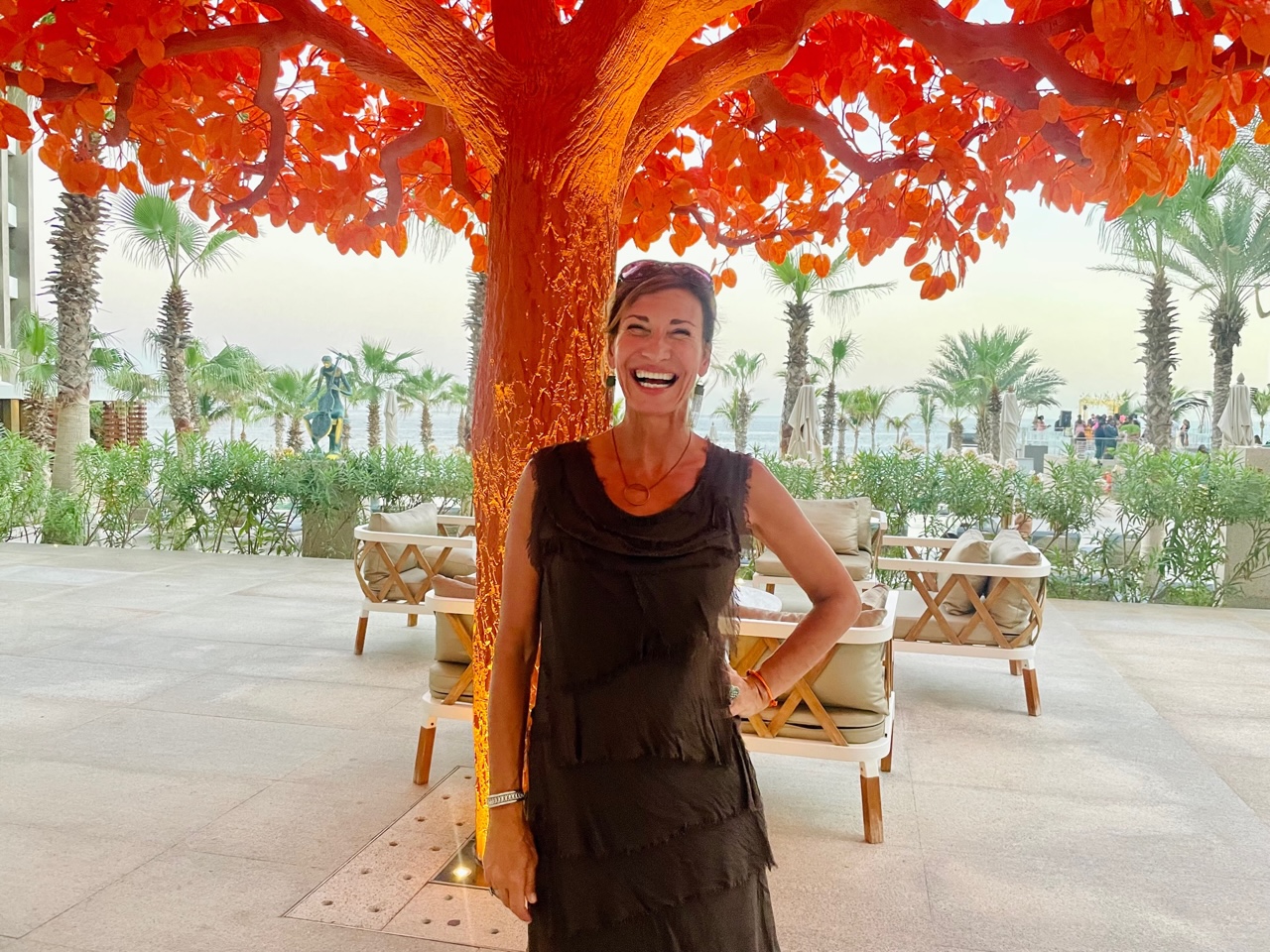 Nicole Apelian in front of lit tree