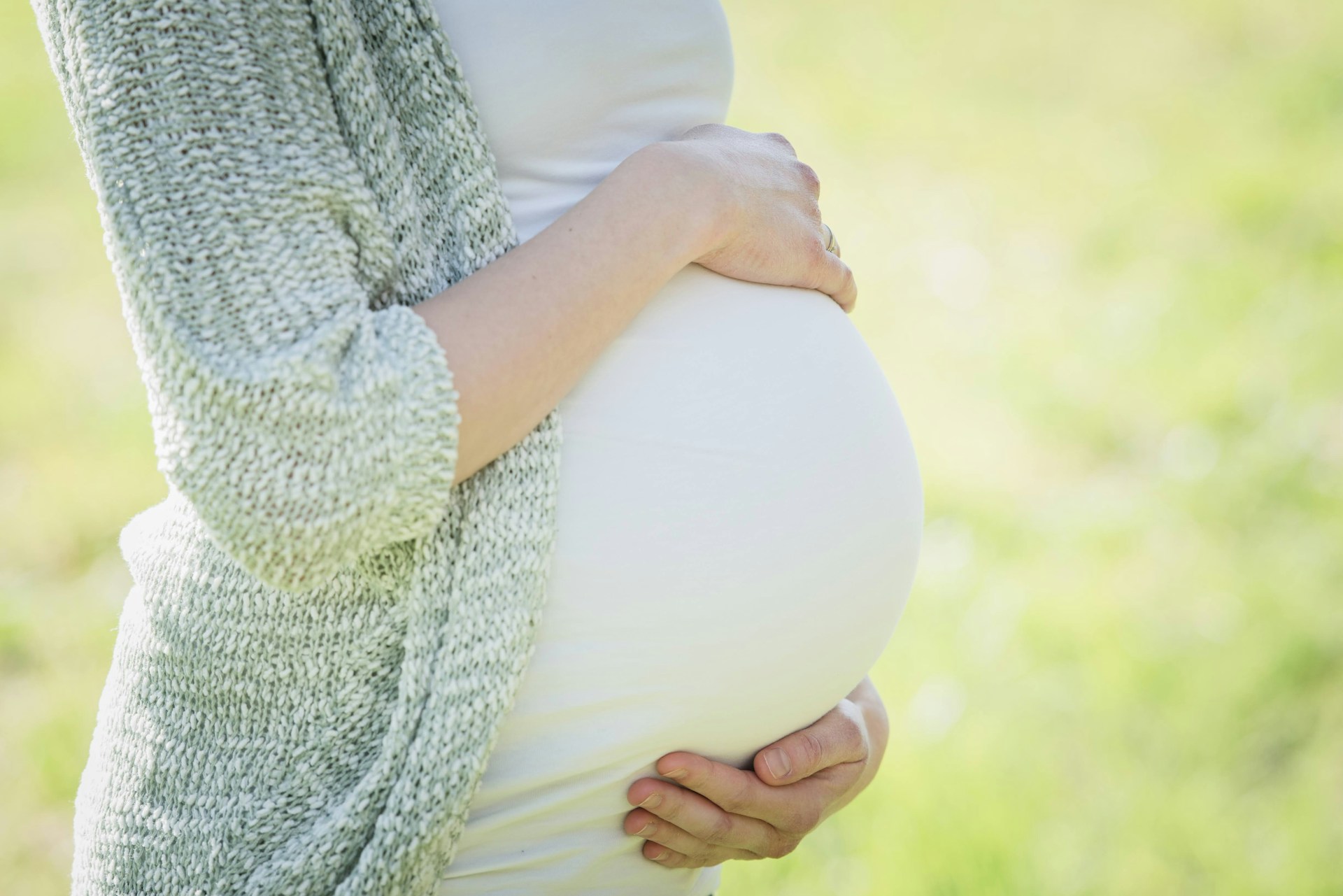 pregnant mother holding her belly