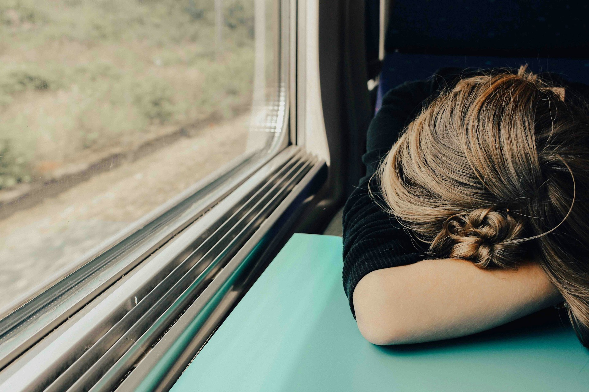 woman sleeping on a train