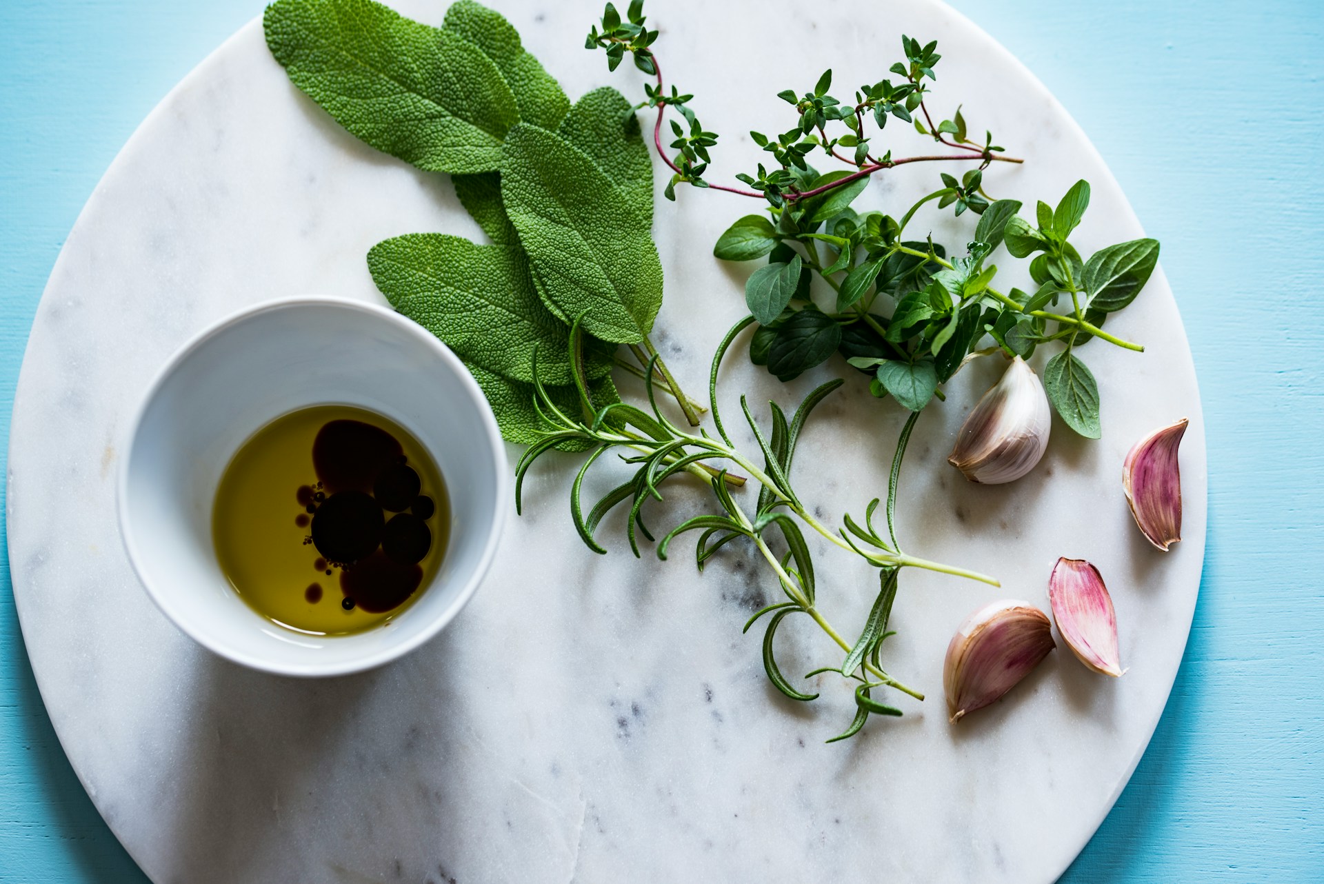 dipping of olive oil and vinegar with fresh herbs and garlic