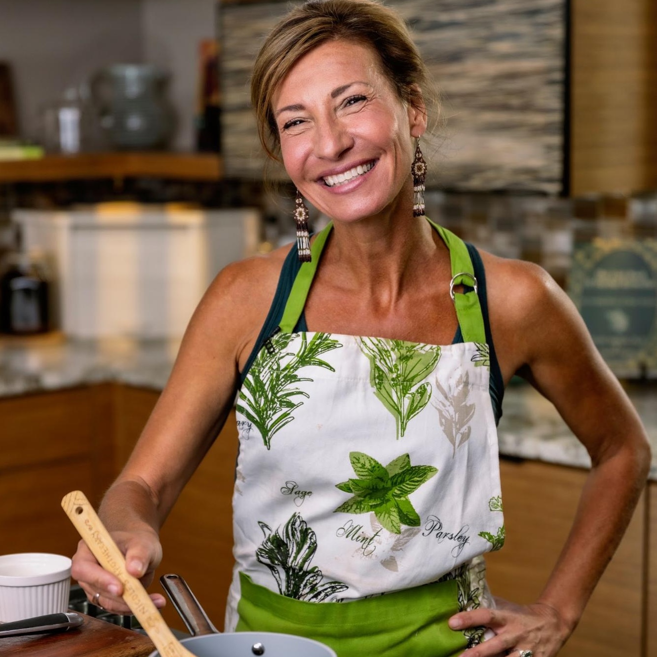 Nicole Apelian stirring pot on stove