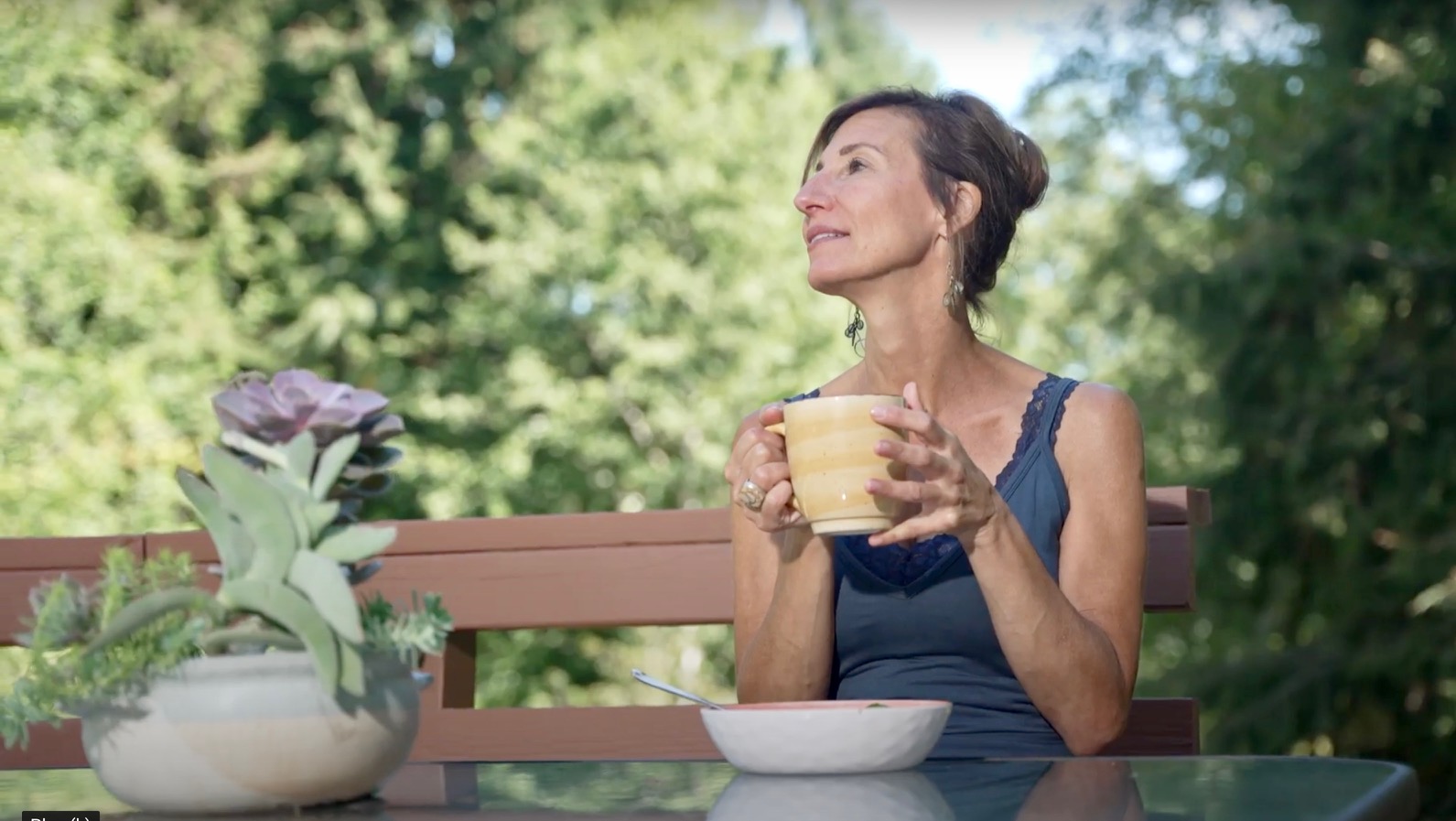 Nicole Apelian drinking mug of tea on deck