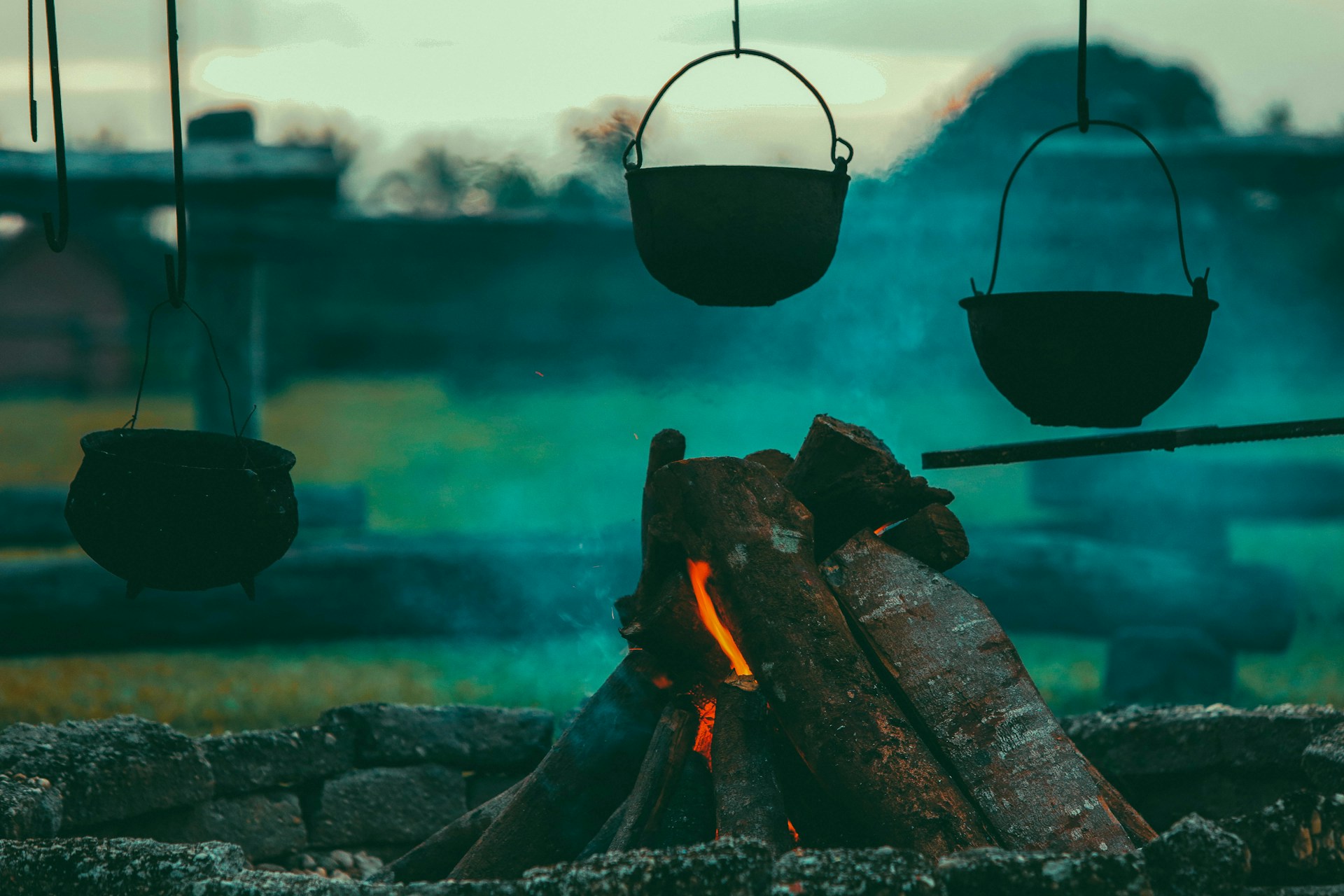 hanging pots over campfire