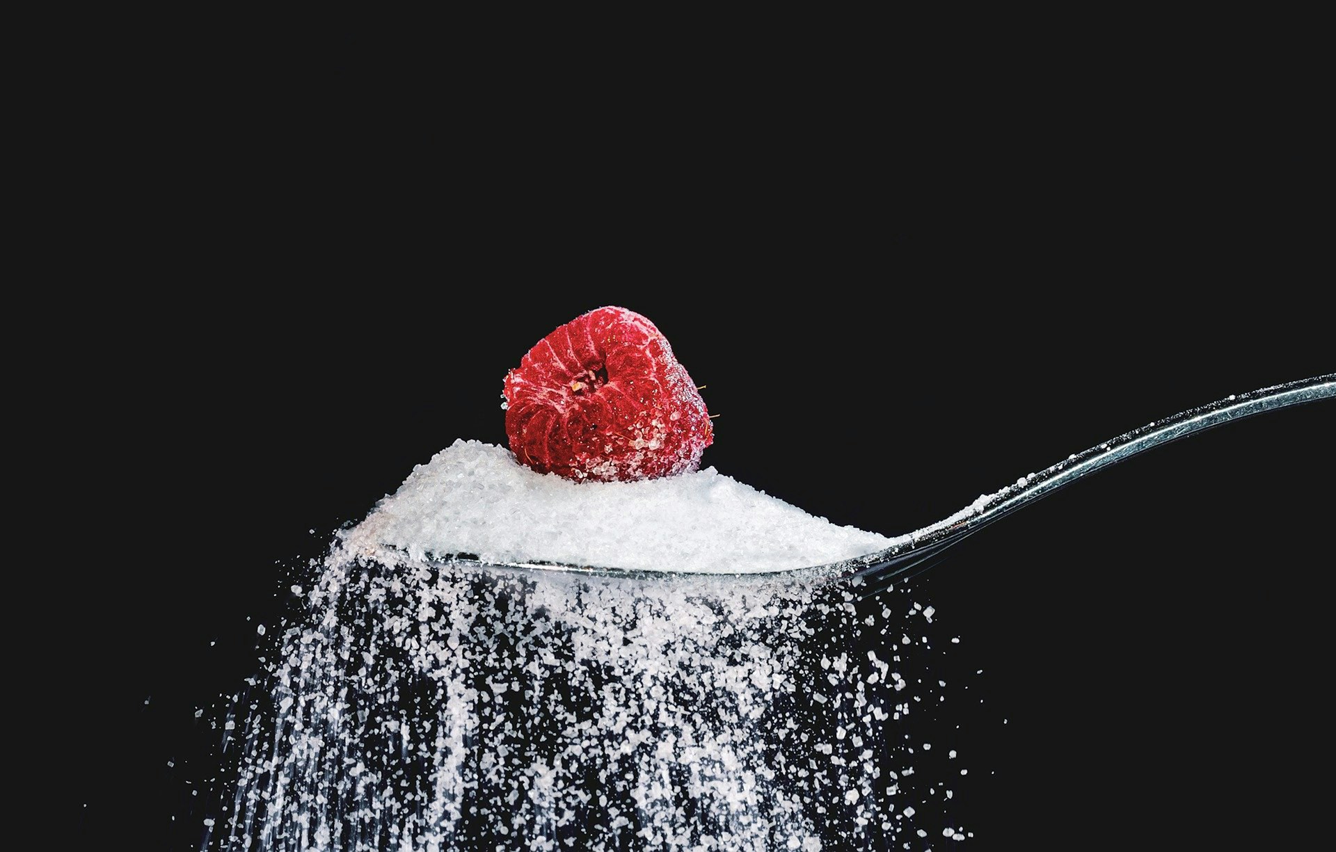 raspberry on a spoonful of sweetener