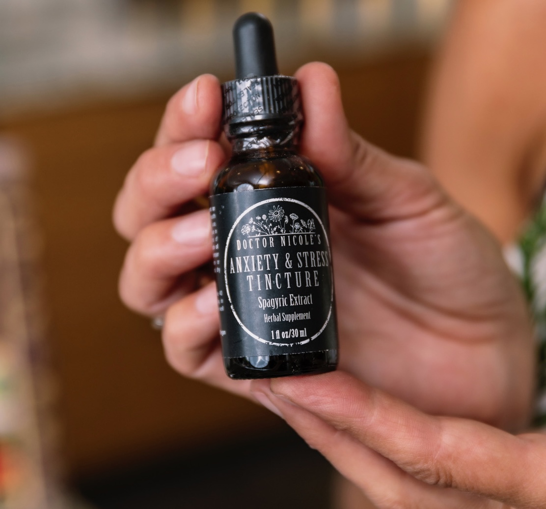 Nicole Apelian holding Anxiety Stress Tincture