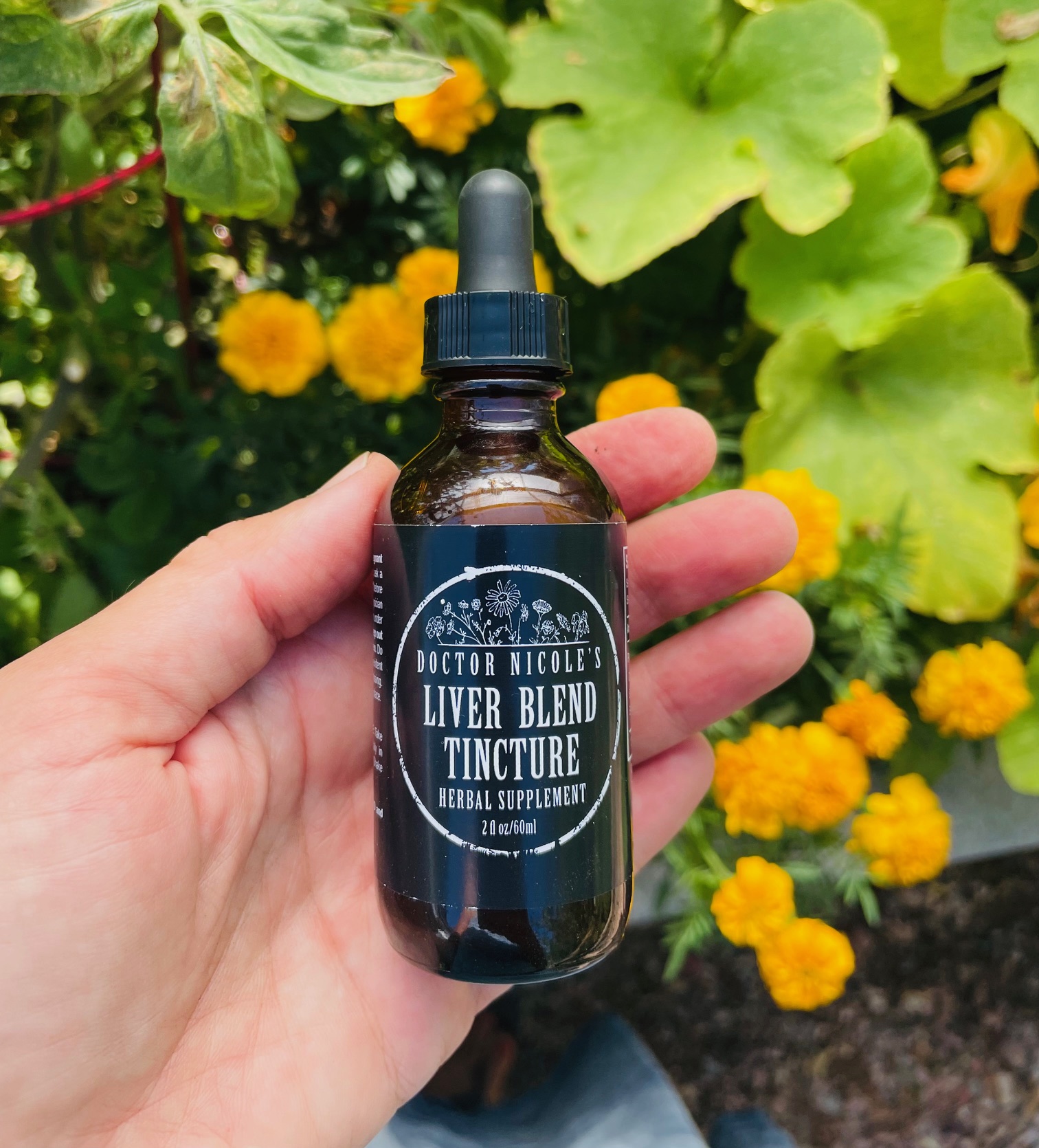 hand holding Liver Blend tincture