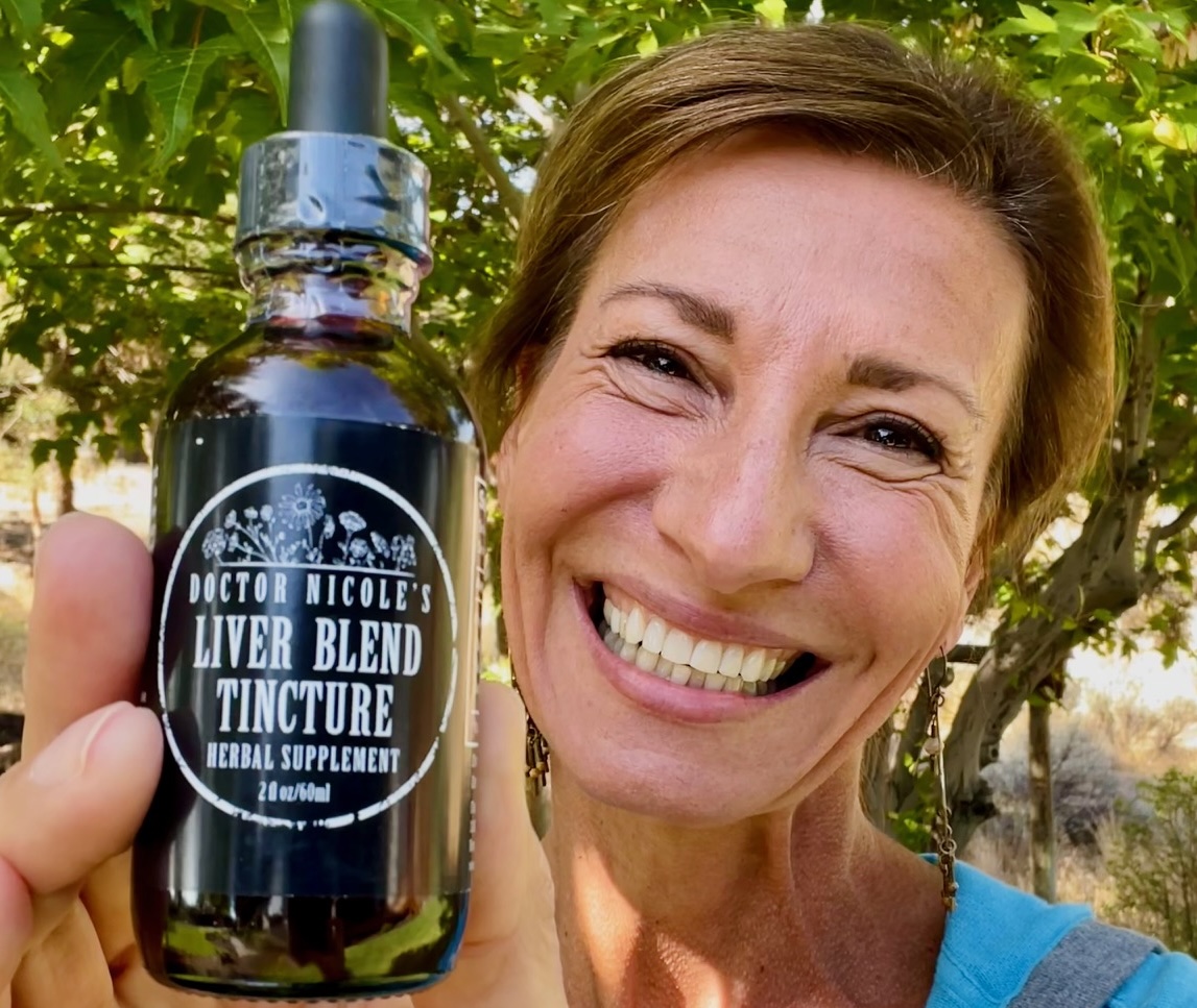 Nicole Apelian holding Liver Blend tincture