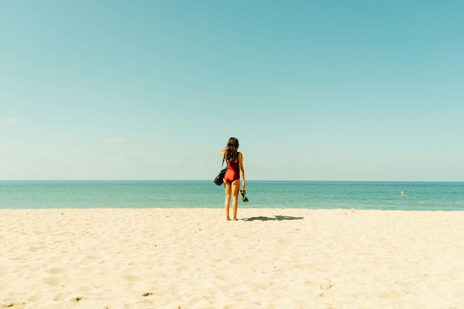 woman standing on beach woman standing on beach