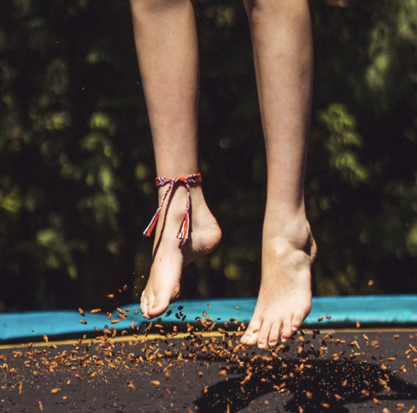 anklet feet jumping on trampoline